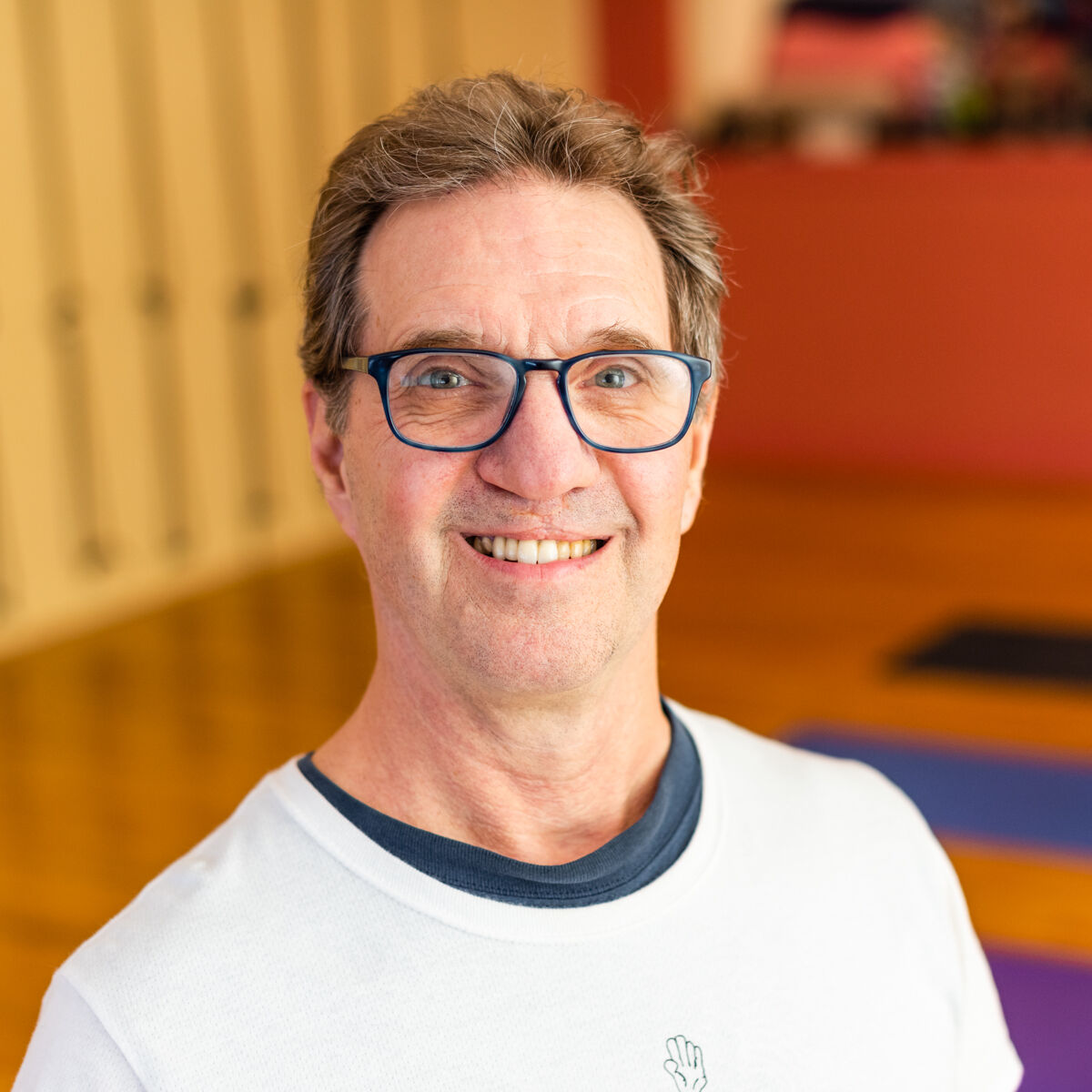 Photo of William Protteinger in a yoga studio