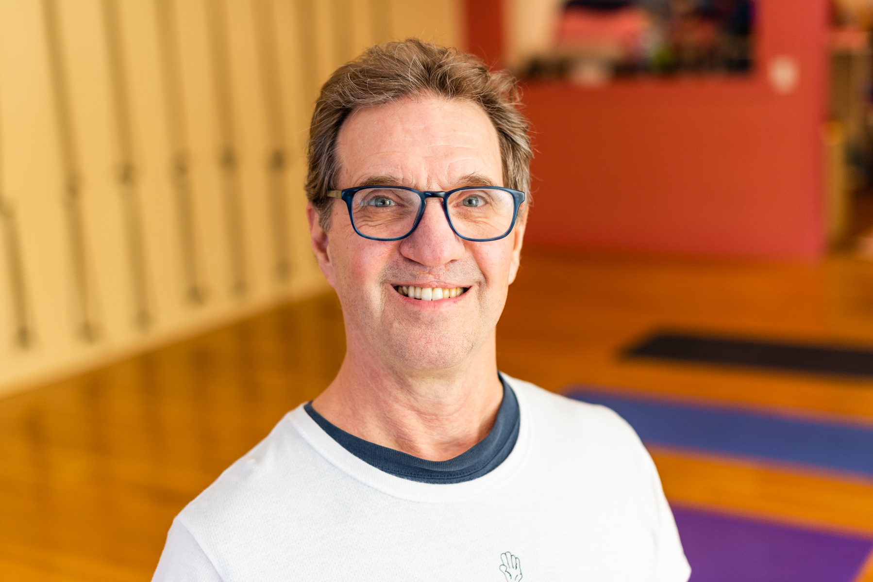 Photo of William Protteinger in a yoga studio